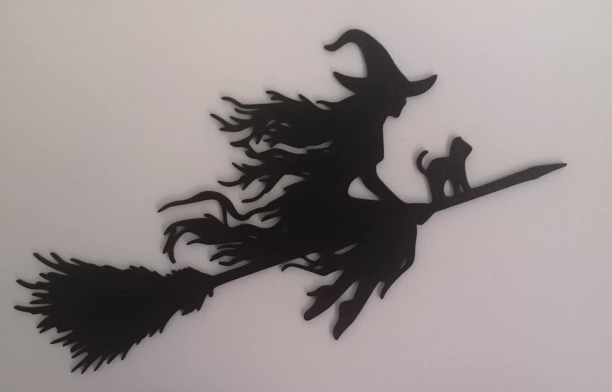 Black silhouette of a witch flying on a broomstick with a small cat seated in front, shown on a light background.